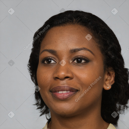 Joyful black young-adult female with medium  black hair and brown eyes