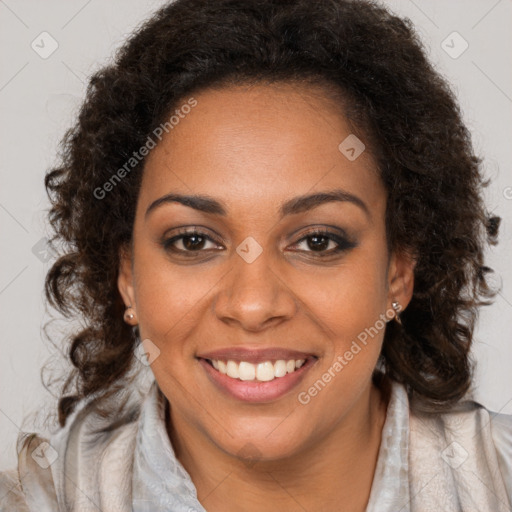 Joyful black young-adult female with long  brown hair and brown eyes