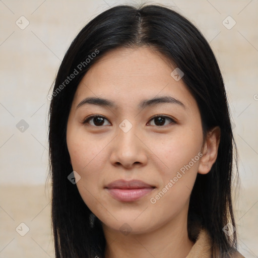 Joyful latino young-adult female with long  black hair and brown eyes