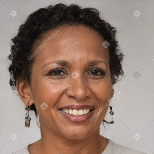 Joyful black adult female with short  brown hair and brown eyes