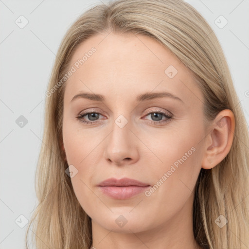 Joyful white young-adult female with long  brown hair and blue eyes