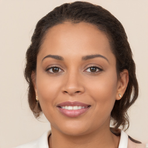 Joyful white young-adult female with medium  brown hair and brown eyes