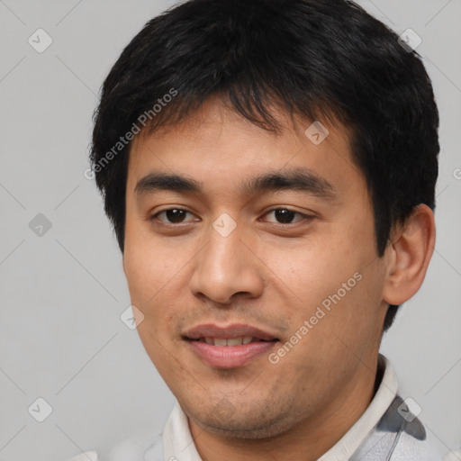 Joyful asian young-adult male with short  black hair and brown eyes