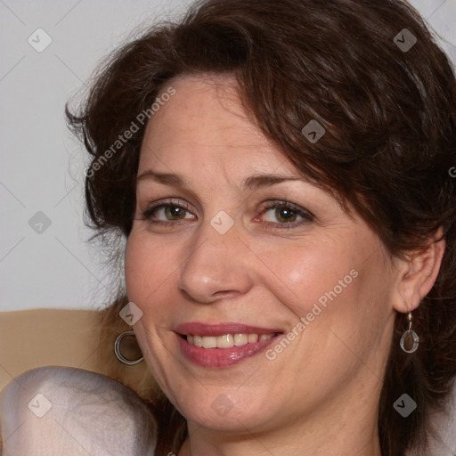 Joyful white adult female with medium  brown hair and blue eyes