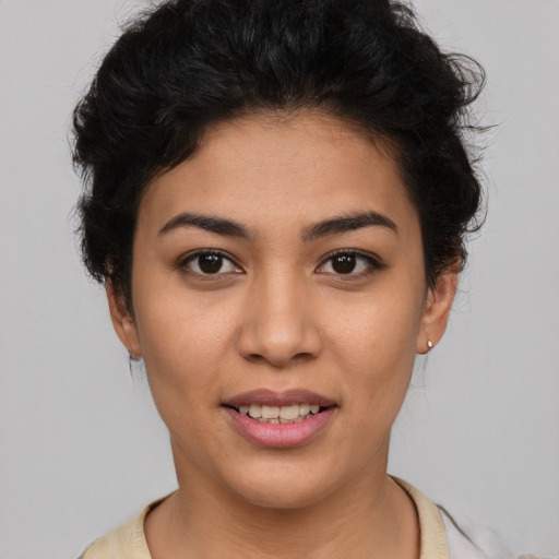 Joyful latino young-adult female with short  brown hair and brown eyes