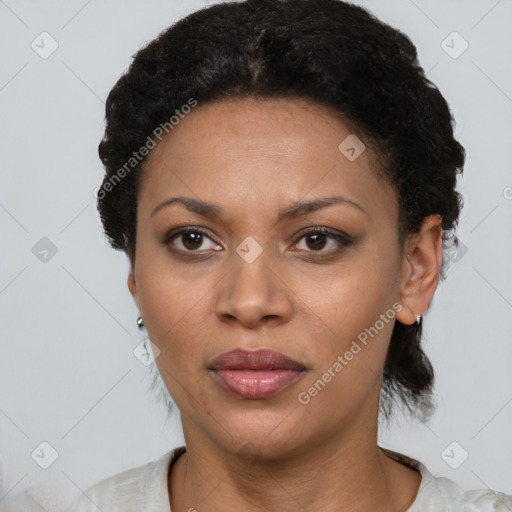 Joyful black adult female with short  black hair and brown eyes