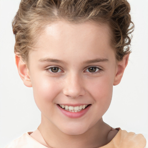 Joyful white child female with short  brown hair and brown eyes