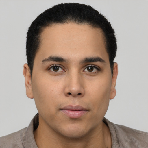Neutral latino young-adult male with short  brown hair and brown eyes