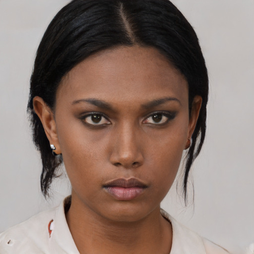 Neutral black young-adult female with medium  black hair and brown eyes