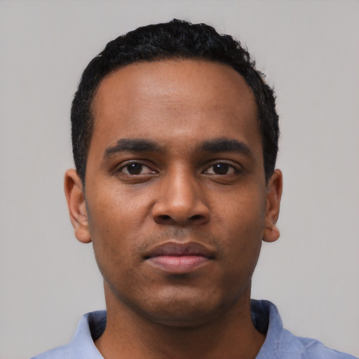 Neutral black young-adult male with short  black hair and brown eyes