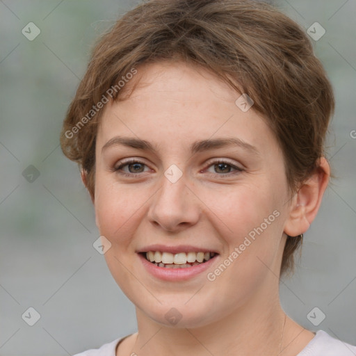 Joyful white young-adult female with medium  brown hair and green eyes