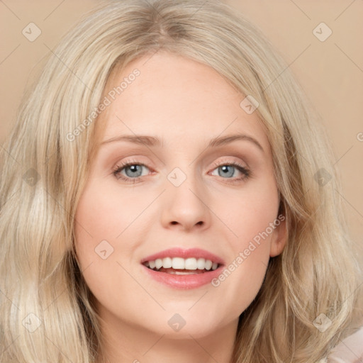 Joyful white young-adult female with long  brown hair and blue eyes