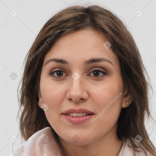 Joyful white young-adult female with long  brown hair and brown eyes