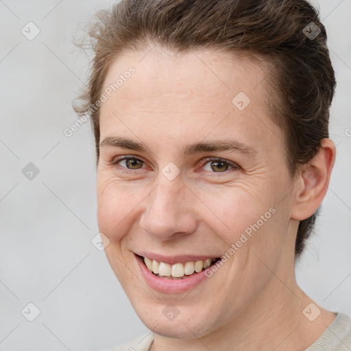 Joyful white adult female with short  brown hair and brown eyes