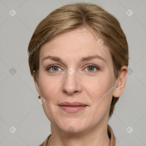 Joyful white adult female with short  brown hair and grey eyes