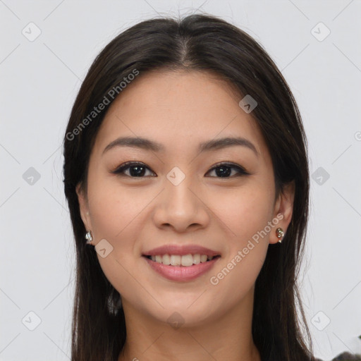 Joyful latino young-adult female with long  brown hair and brown eyes