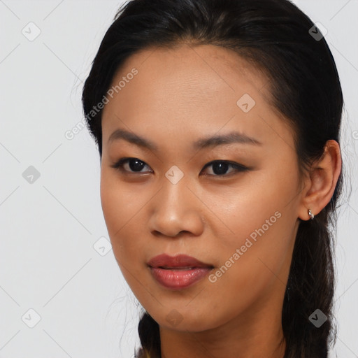 Joyful asian young-adult female with long  brown hair and brown eyes