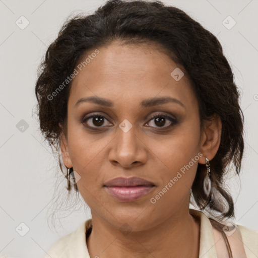 Joyful black young-adult female with medium  brown hair and brown eyes