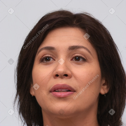 Joyful white adult female with medium  brown hair and brown eyes