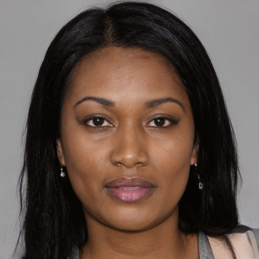 Joyful asian young-adult female with long  black hair and brown eyes
