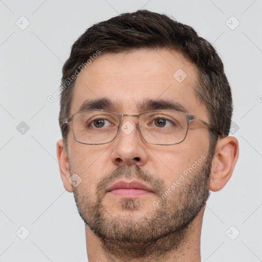 Neutral white adult male with short  brown hair and brown eyes