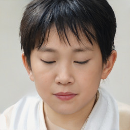 Joyful asian child female with short  brown hair and brown eyes