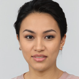 Joyful asian young-adult female with short  black hair and brown eyes