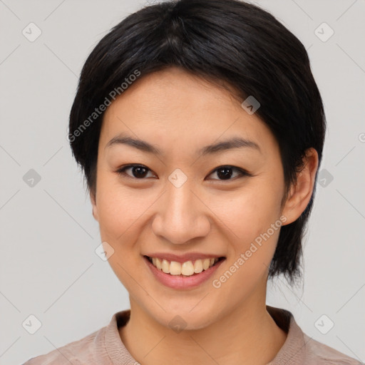 Joyful asian young-adult female with medium  black hair and brown eyes