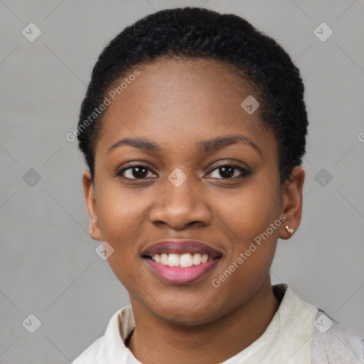 Joyful black young-adult female with short  black hair and brown eyes