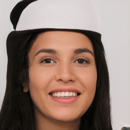 Joyful white young-adult female with long  black hair and brown eyes