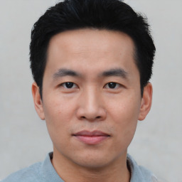 Neutral asian young-adult male with short  black hair and brown eyes