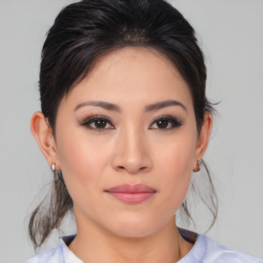 Joyful white young-adult female with medium  brown hair and brown eyes