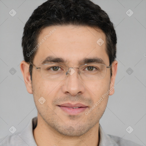 Joyful white young-adult male with short  black hair and brown eyes