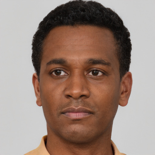 Neutral latino young-adult male with short  brown hair and brown eyes