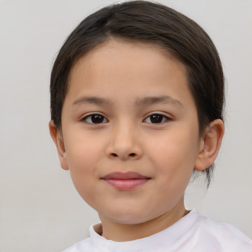 Joyful white child female with short  brown hair and brown eyes