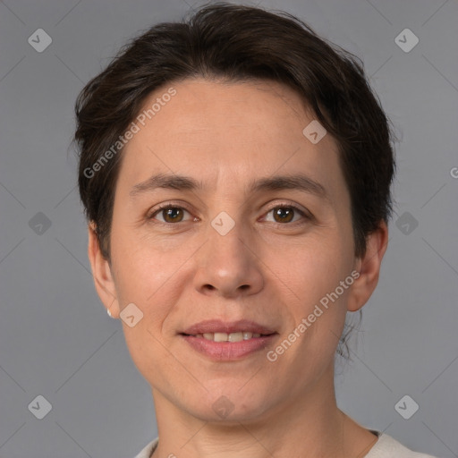 Joyful white adult female with short  brown hair and brown eyes