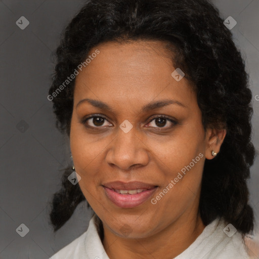 Joyful black adult female with medium  brown hair and brown eyes