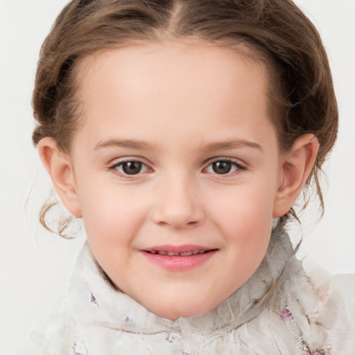 Joyful white child female with medium  brown hair and grey eyes