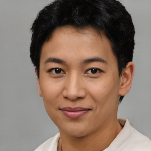 Joyful asian young-adult female with short  black hair and brown eyes