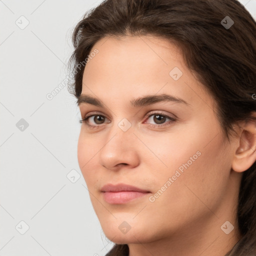 Neutral white young-adult female with long  brown hair and brown eyes