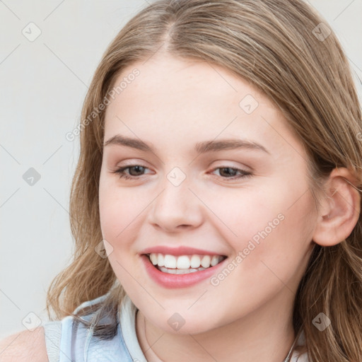 Joyful white young-adult female with long  brown hair and blue eyes