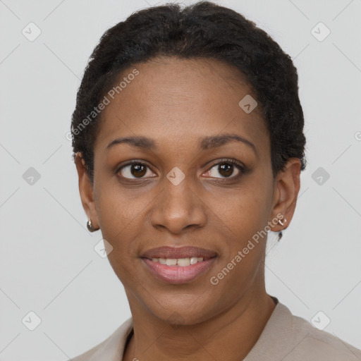 Joyful black young-adult female with short  brown hair and brown eyes