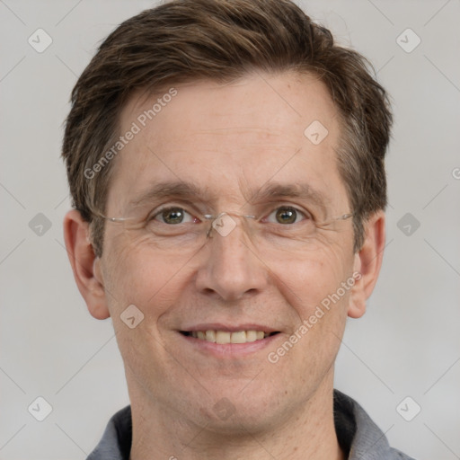 Joyful white adult male with short  brown hair and grey eyes