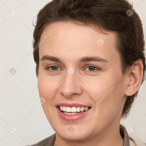 Joyful white young-adult female with short  brown hair and grey eyes