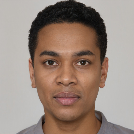 Neutral black young-adult male with short  black hair and brown eyes