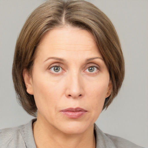 Neutral white adult female with medium  brown hair and grey eyes