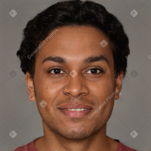 Joyful black young-adult male with short  brown hair and brown eyes