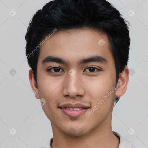 Joyful asian young-adult male with short  black hair and brown eyes