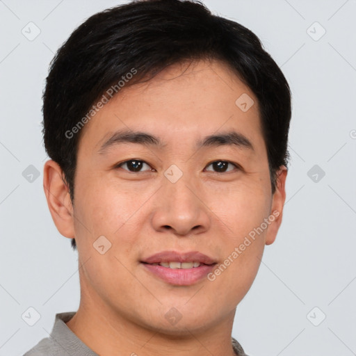 Joyful asian young-adult male with short  brown hair and brown eyes