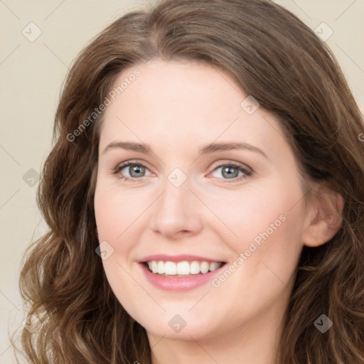 Joyful white young-adult female with long  brown hair and green eyes